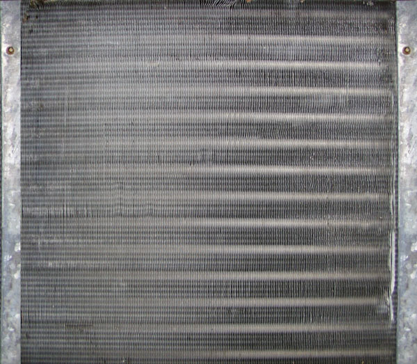 Clean evaporator coils with in-duct air purifier