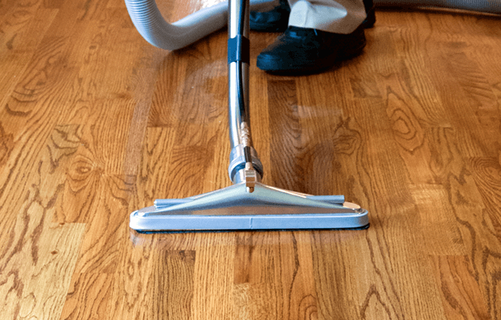 Hardwood floor cleaning machine being used by technician