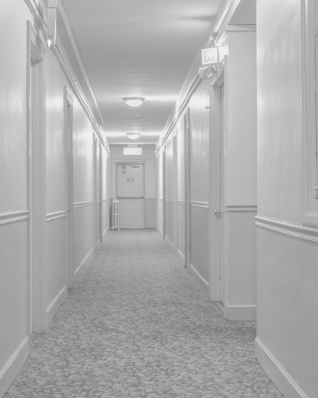 Hallway of apartment complex with carpeting
