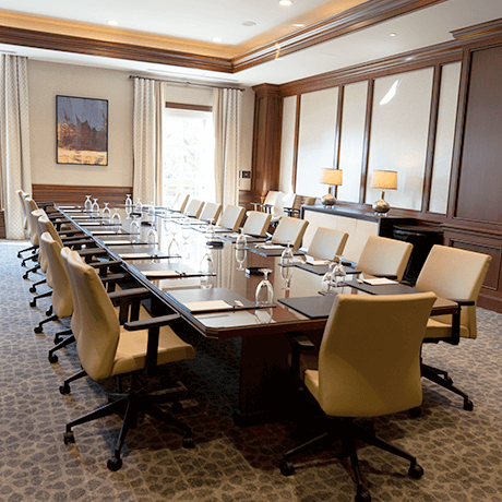 Conference room with large table and chairs in event center