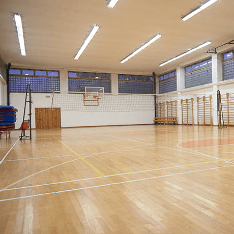 Court with hardwood floors in fitness facility