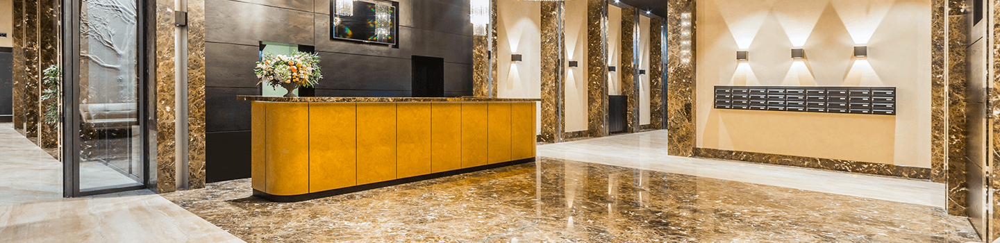 Spacious lobby of hotel with stone floors